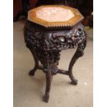 A 19th Century Chinese rosewood jardiniere stand.