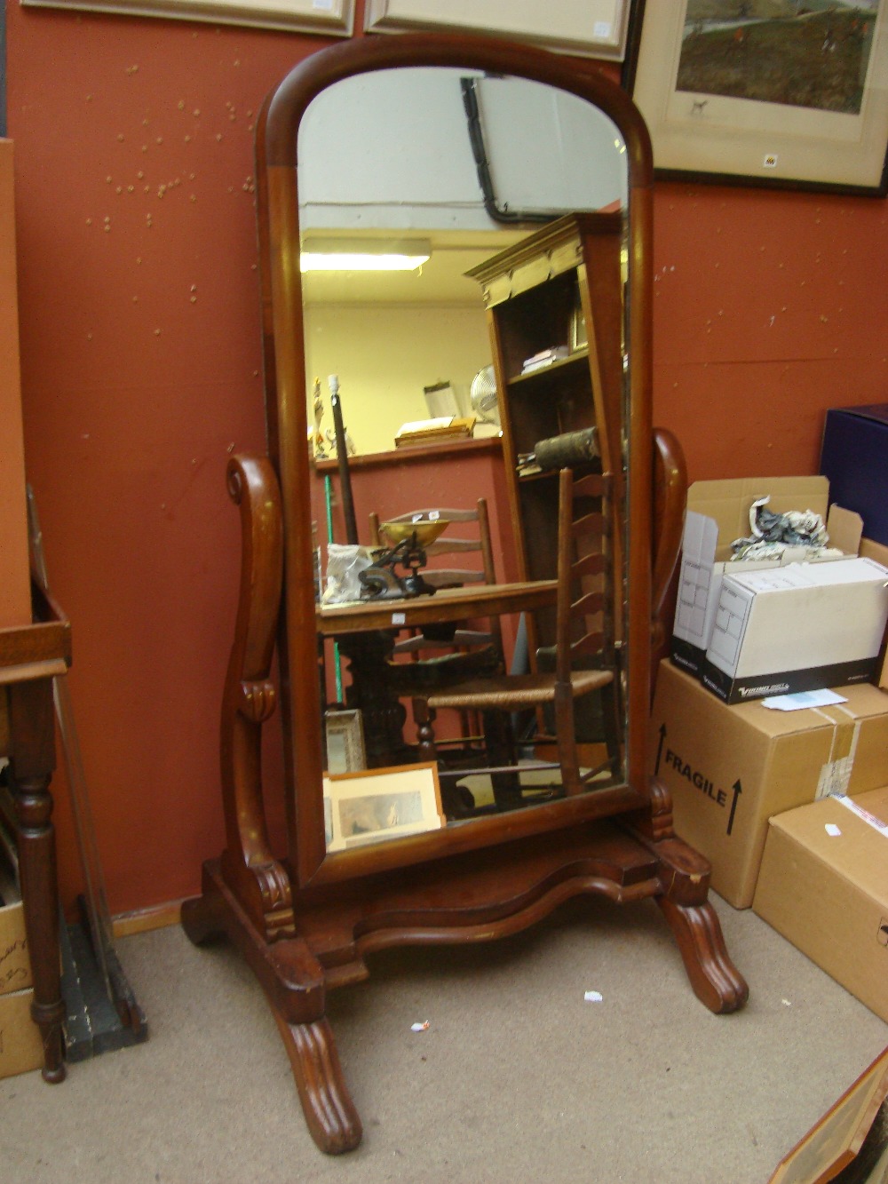 A Victorian mahogany Cheval mirror.