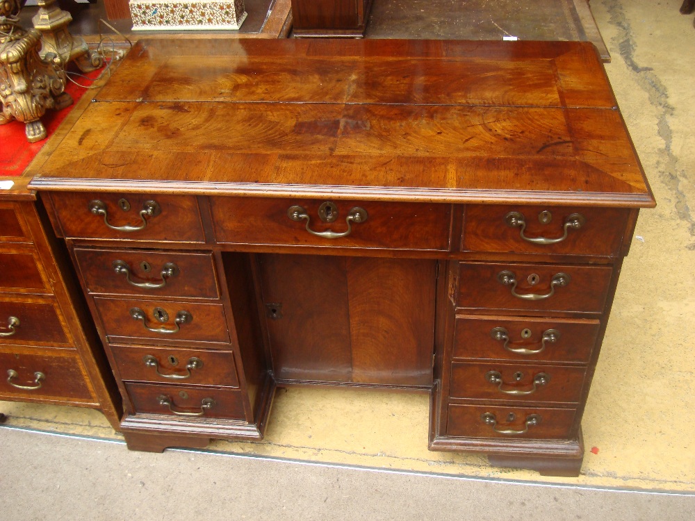 A George III mahogany secretaire with fitted interior,