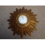 An early 20th Century French giltwood sunburst wall clock, with eight day brass movement.