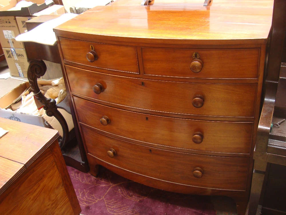 A mahogany bow front chest of drawers, two short drawers over three long. 108 x 53 x 106cm high.