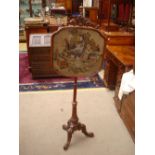 A Victorian walnut pole screen, glazed tapestry and raised wool work panel,
