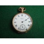 A Waltham 9ct cased pocket watch (one hand off but present).