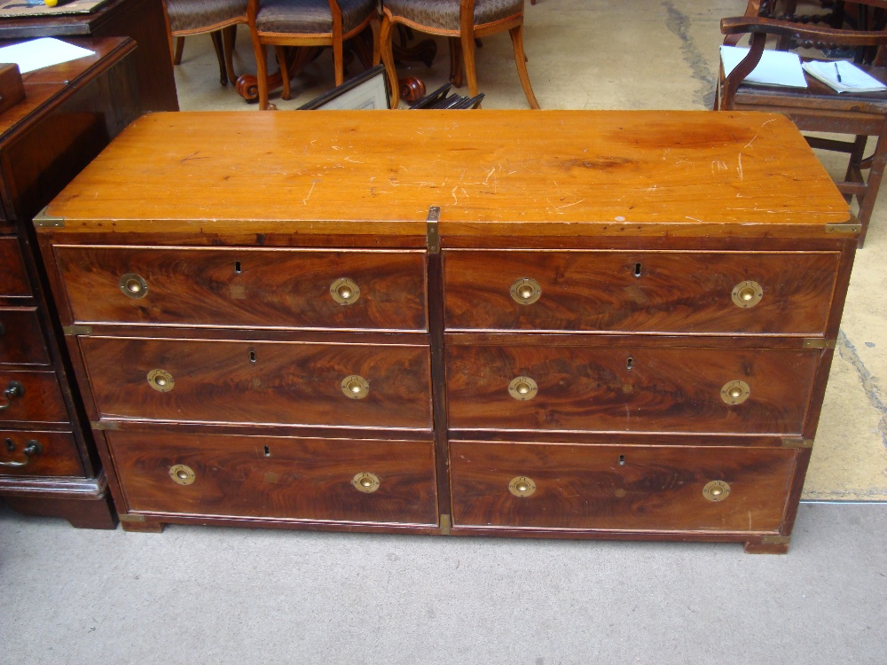 A 19th Century military style campaign chest of six drawers, with later inset brass ring handles.