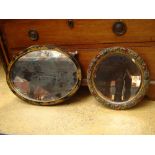 A 1920's gilt and black chinoiserie framed oval mirror and a small circular barbola mirror (2).