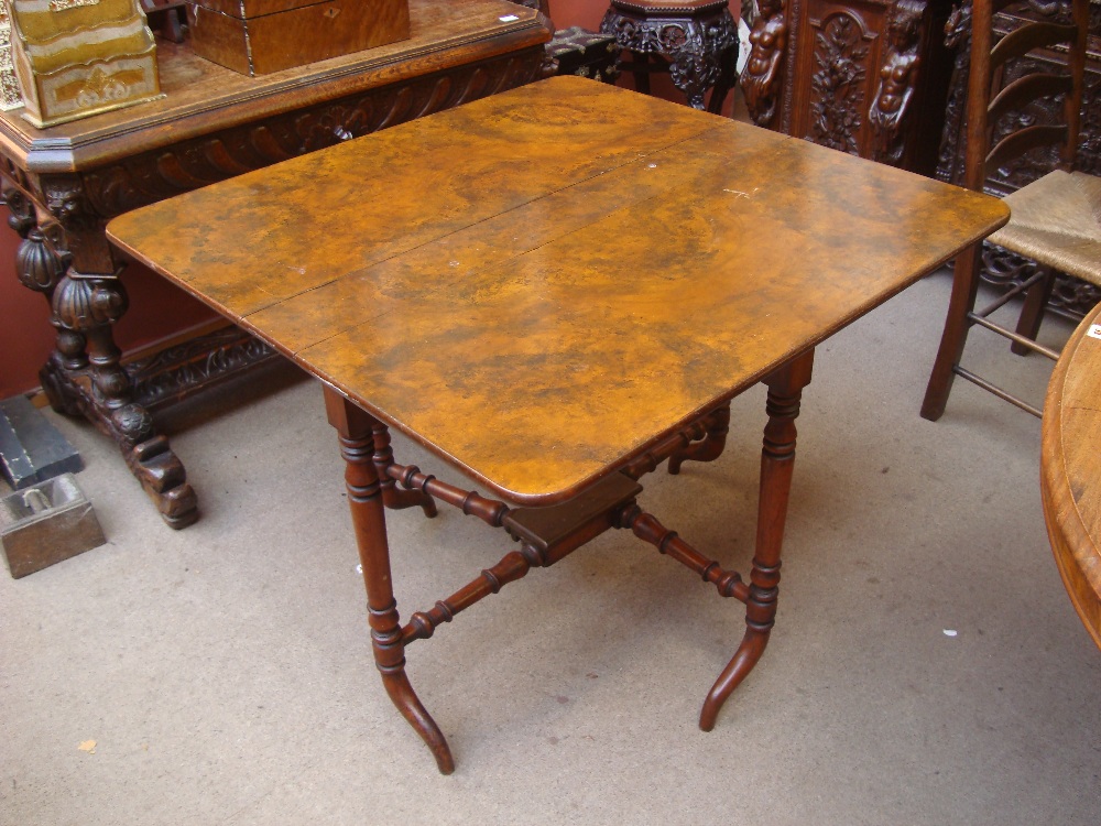 A 19th Century walnut and mahogany Sutherland table.