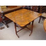 A 19th Century walnut and mahogany Sutherland table.