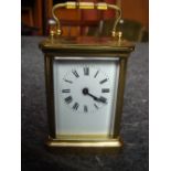 A brass carriage clock.