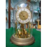 A 20th Century German gilt brass anniversary clock under dome.