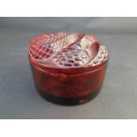 A Lalique red glass lidded circular pot with snake design to lid,