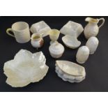 A selection of Belleek Third Period ceramics including jugs, cup, ashtrays,