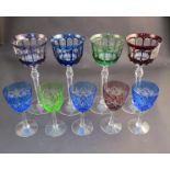 Four coloured crystal glass hock glasses and five smaller examples