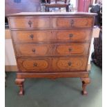 A George II Revival inlaid walnut chest on stand the two short over three graduating long drawers