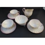 A Belleek Second Period part scallop form tea set comprising jug,