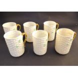 Six Belleek Third Period coffee cups with woven effect bodies and three leaf clover detail