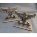 A pair of 19th Century cast iron aesthetic stylized eagle andirons,