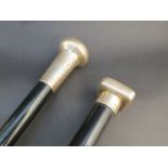 Two ebony silver topped walking canes including square knopped example,