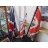 Three vintage Union Flags on poles