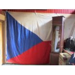 A Czechoslovakian flag of large proportions,