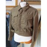 A British 1950 dated battledress blouse and trousers