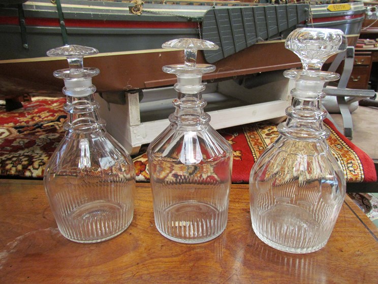 Three Georgian ring neck decanters with stoppers