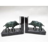 A pair of bronzed spelter wild boar book ends with marble base