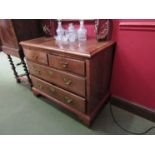 A Georgian walnut two over two chest of drawers,