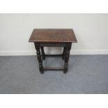 A 17th Century oak joined stool with later top