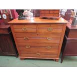 An Edwardian satinwood two over three chest of drawers,