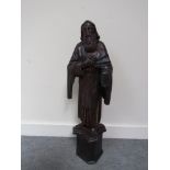 A 17th/18th Century carving of a French Saint on later base