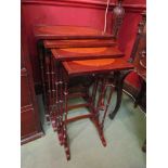 A nest of four mahogany tables with oval inlay to top,