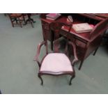 An Edwardian mahogany carver chair with classical inlaid back, silk upholstered seat,