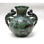 A Barum green ground vase with twin dragon handles and carp design, signed J.P.