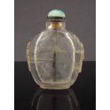 A Chinese rock crystal snuff bottle with gold hair markings with kylin mask and ring handles,