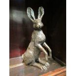 A bronzed finish seated hare 20cm tall