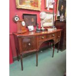 A Georgian mahogany sideboard, central drawer flanked by cupboards,