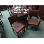 A set of 4+1 carver 1940's oak red leather dining chairs with stud decoration and twisted front