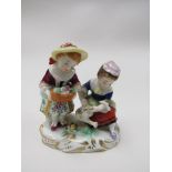 A figural group of two females gardening, gold anchor mark to base,