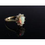 An opal and white stone dress ring