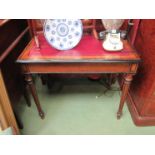 A late Regency side table with red leather insert, ebony inlay to melon fluted legs,