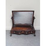 A mahogany Regency Serpentine front table mirror with two drawers,