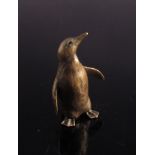 A miniature solid bronze penguin,