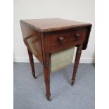 A 19th Century mahogany sewing table with single drawer and rising flaps