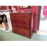A mid Victorian walnut chest of two short over three long drawers on shaped feet,