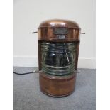 An early 20th Century copper ship's lamp with plaque marked I.H.