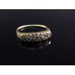 A gold five stone diamond ring