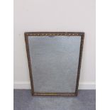 A rectangular bevel edged wall hanging mirror with rope twist decorative gilt frame,