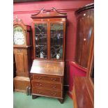 An Edwardian mahogany glazed bureau bookcase with classical inlay,
