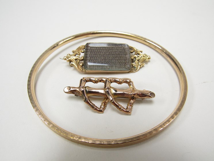 A Victorian brooch as two hearts,