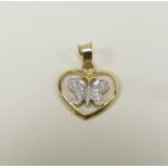 A gold heart shaped pendant with diamond encrusted butterfly to centre